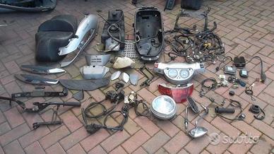 Beverly 500 06: scudo faro motore pompa pinza km