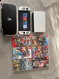 Nintendo Switch OLED + custodia + 6 giochi + Ring