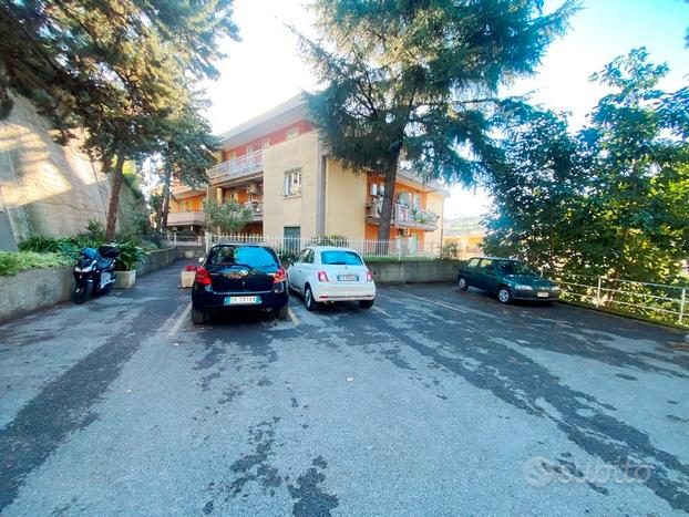 Bilocale con giardino e posto auto condominiale