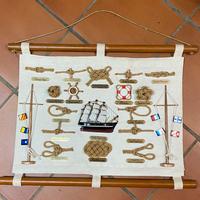 Quadro con nodi marinari e barchetta