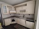 cucina-completa-in-legno-arte-povera-colore-panna