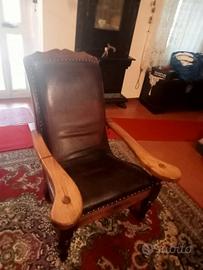 Poltrona vintage in pelle e legno massello 