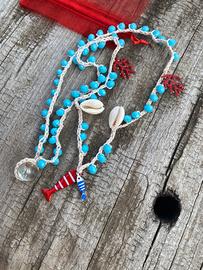 Collana con pesce conchiglie e coralli