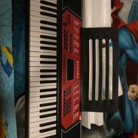 Piano elettrico con cuffie e supporto per tastiera