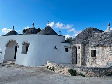 Appartamento in trulli e lamie con giardino