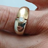 anello uomo in oro bianco e giallo.