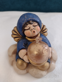 Thun angelo blu su nuvola