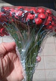 coccinelle di legno con stelo