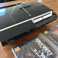 Play Station 3 con controller e due giochi