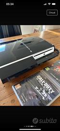 Play Station 3 con controller e due giochi