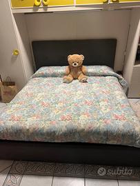 Armadio a ponte con letto mateimoniale