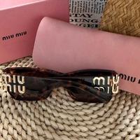 Occhiali da sole marrone da donna miumiu