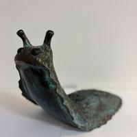 Rara lampada a forma di lumaca in bronzo