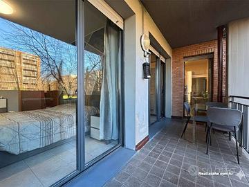 Bilocale con ampia loggia e giardino privato