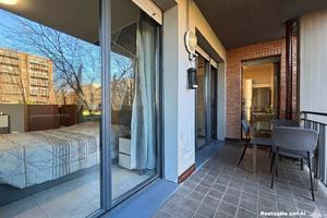 Bilocale con ampia loggia e giardino privato