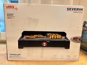Barbecue da tavolo con bistecchiera
