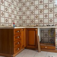 Cucina con top e piano cottura