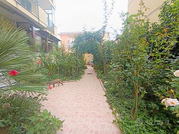 Appartamento con giardino e box auto