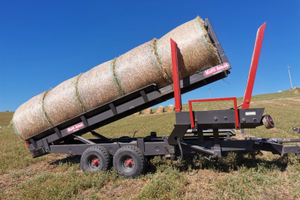 Carrello autocaricante per rotoballe