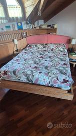 letto ad angolo con testiera contenitore