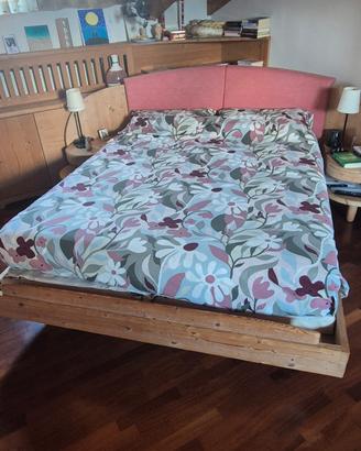 letto ad angolo con testiera contenitore