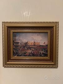 Quadro con cornice dorata