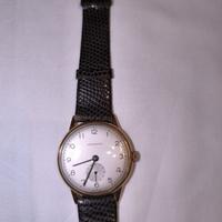 Orologio Longines con guscio in oro 18k