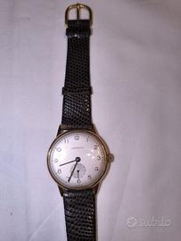 Orologio Longines con guscio in oro 18k