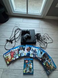 playstation 4 con controller, caricatori e fifa 22