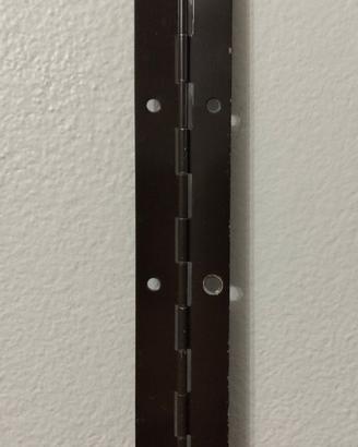 Cerniera a metraggio per porte/ante