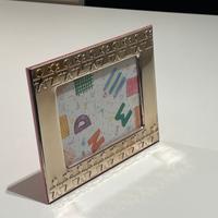 Cornice portafoto in argento dorato e legno rosa