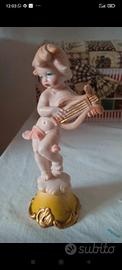 Statuina con angioletto.