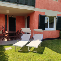 Appartamento con veranda e giardino privato