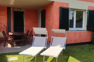 Appartamento con veranda e giardino privato