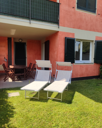 Appartamento con veranda e giardino privato