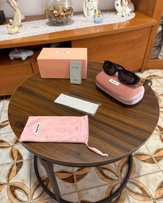 Occhiali miu miu da sole nero e oro