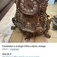 Orologio trittico con candelabri