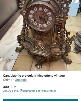 Orologio trittico con candelabri