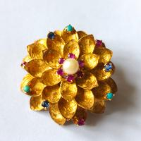 Spilla anni 60 in oro e pietre preziose