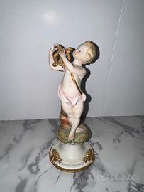 Puttino con lira VOLTA porcellana