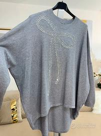 Maglia grigia con fiocco gioiello