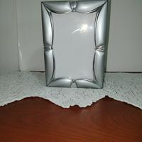 Cornice portafoto con album incorporato