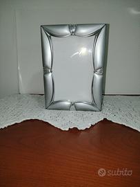 Cornice portafoto con album incorporato