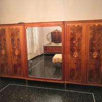 Camera da letto armadio testiera specchio