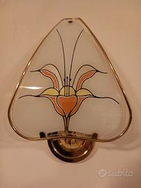 Applique in vetro colorato e metallo