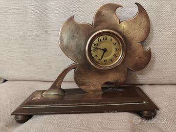 orologio antiquariato fatto a fiore 