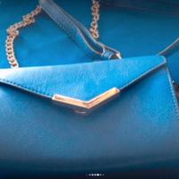 Pochette blu royal nuova con etichetta primadonna