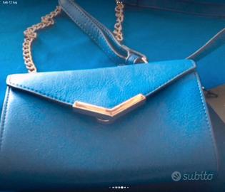 Pochette blu royal nuova con etichetta primadonna