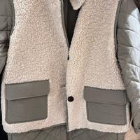 tra puntina con gilet in pelliccia.eco