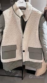 tra puntina con gilet in pelliccia.eco